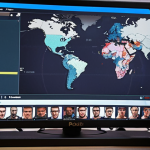 **A Polish streamer enthusiastically playing "Whiteout Survival" on their computer. The streamer is surrounded by gaming equipment and has a dedicated streaming setup. The screen shows the game with a complex base and ongoing battle. Chat window visible with positive and engaging comments in Polish.** (Focus: Captures the excitement of a streamer engaging with the game and their audience, localized with Polish language.)